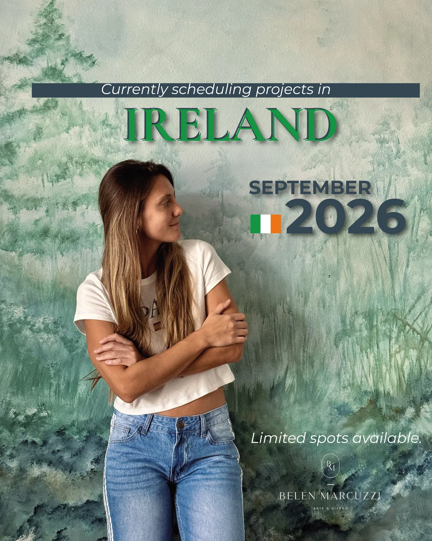 Announcement: Belén Marcuzzi is currently scheduling projects in Ireland for September 2026. Limited spots available. She stands in front of one of her forest murals in soft greens.